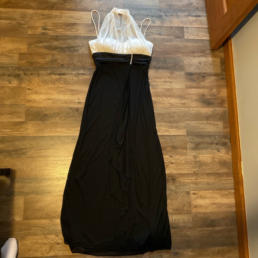 Worn once size small. Black and White formal dress. Sheer halter and overlay,